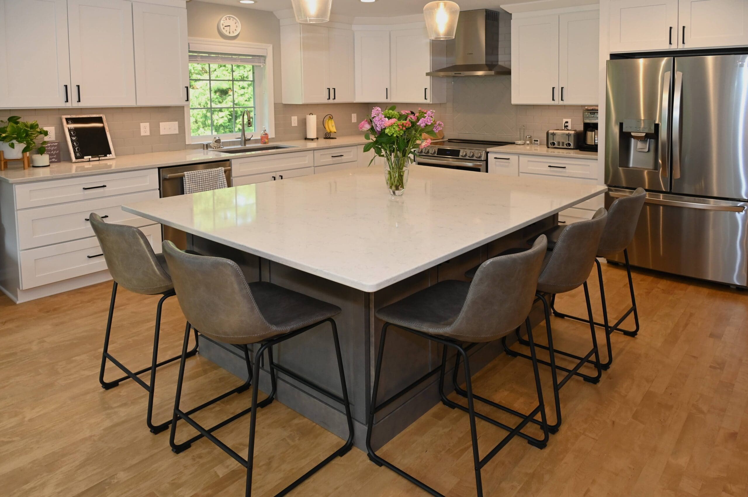 Home addition for a kitchen expansion with larger island, and first-floor remodel in Hartland, Wisconsin.